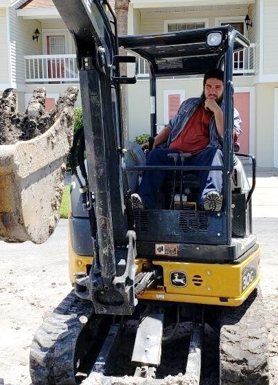 Charlie using a digger